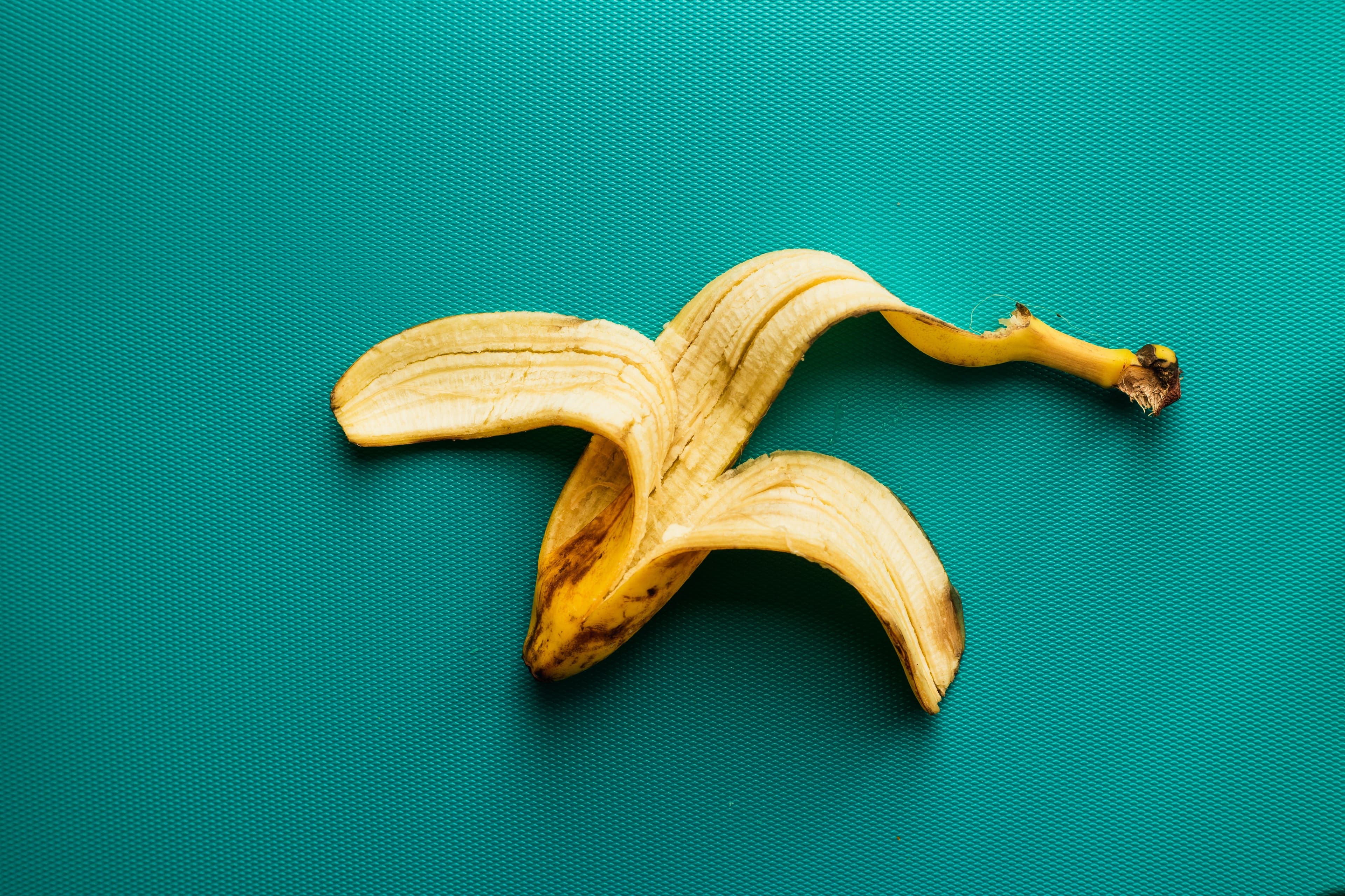 Banana peel over blue background
